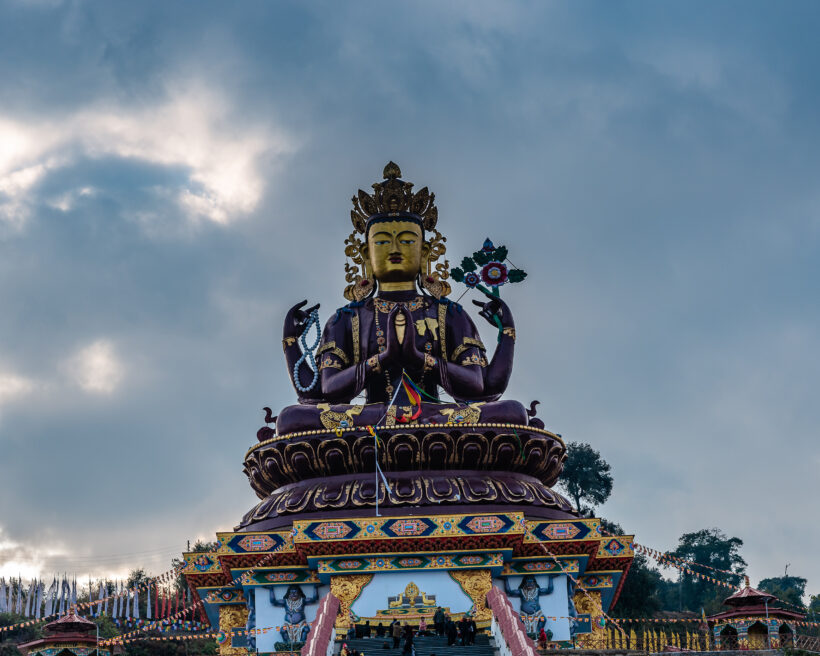 Close up of Huge metallic statue of Chenrezig at The Chenrezig S